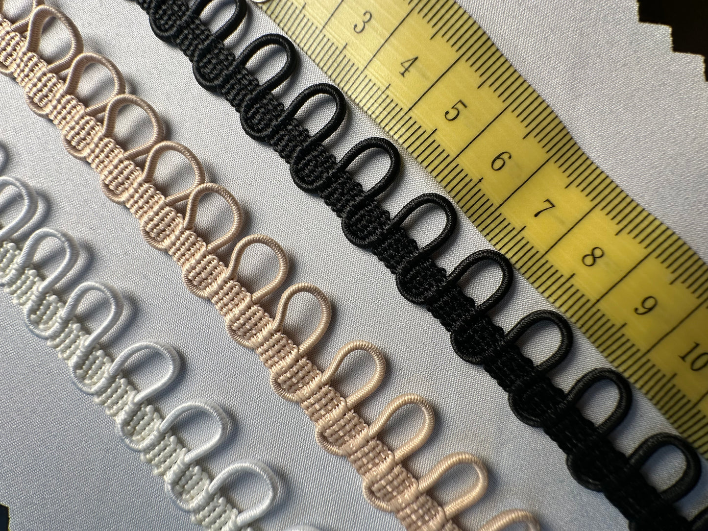 braided ribbon with elastic button loops in white, nude or black