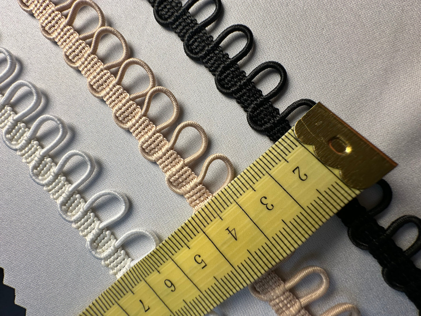 braided ribbon with elastic button loops in white, nude or black